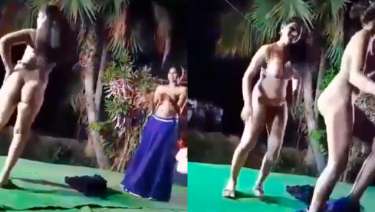 Two girls dancing naked on stage shaking their asses